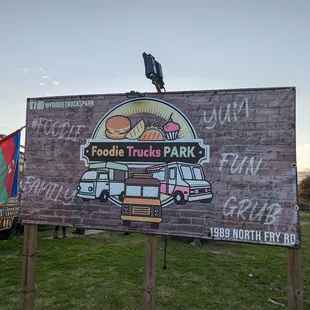 a sign for food trucks park