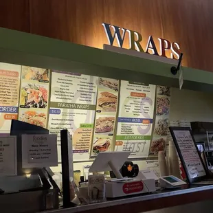 menus on the wall of a restaurant