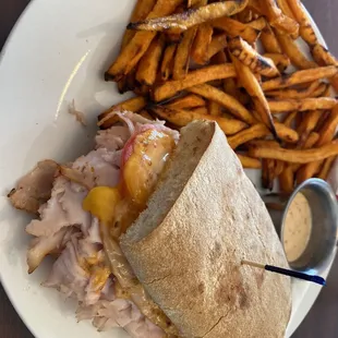 a sandwich and french fries on a plate
