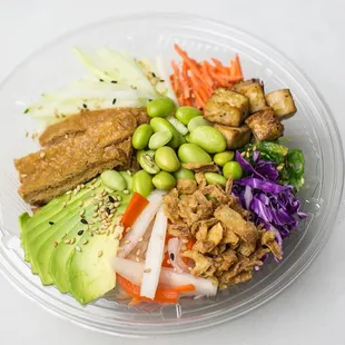 a plastic bowl with a variety of food