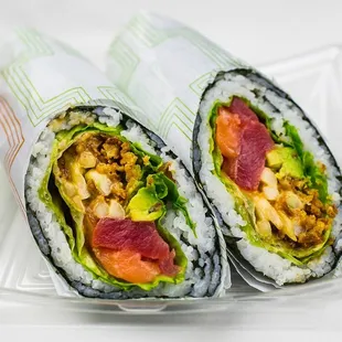 two sushi rolls in a plastic container