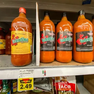 bottles of hot sauce on a shelf