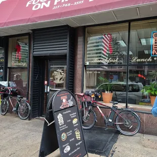 bikes parked in front of a restaurant