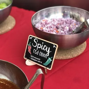 Chopped red onions , topped with orange Serrano peppers for a little spice.