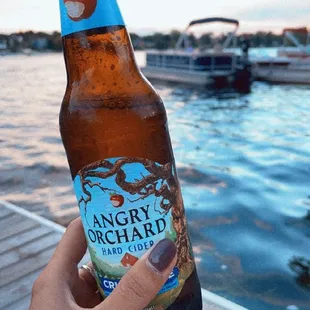a person holding a beer bottle