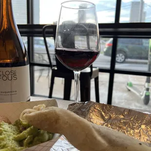 Red wine, chips and guacamole, and hatch green chili braised carne burrito.  The chips and the tortillas were fresh and obviously handmade.