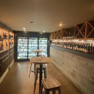 a wine cellar with a variety of bottles
