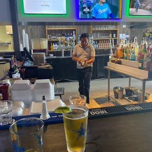 a man serving drinks