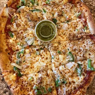 a plate of salad and a pizza on a table