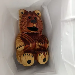 a teddy bear in a bag