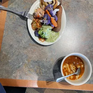 a plate of food and a bowl of soup