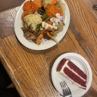 a plate of food and a piece of cake