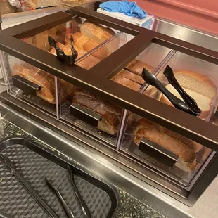 a counter with bread and other food items