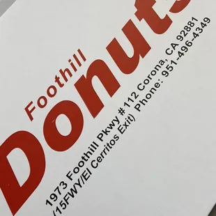 a close up of a box of donuts