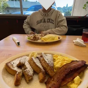 Bacon, scrambled eggs, french toast, chorizo and eggs, country red potatoes, my girlfriend.
