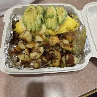Meat omelette, add avocado with country potatoes.