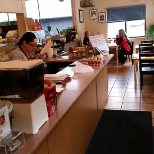 a woman sitting at the counter