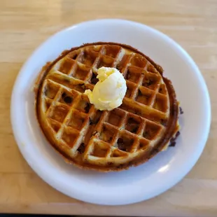 Belgian waffle with bacon and chocolate chips inside.