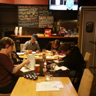 a group of people sitting at a table