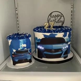 a blue car and a birthday cake