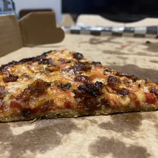 a slice of pizza in a box