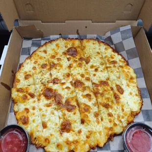 Garlic Cheesy Breadsticks (It&apos;s like a sauce free cheese pizza. Gluten free yummy crust and the marinara sauce was delish!)