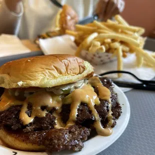 Double cheeseburger, fries and single cheeseburger.
