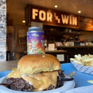 Double burger and fries and a beer