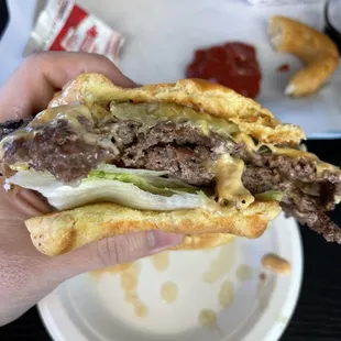 Double patty cheeseburger with lettuce and tomato