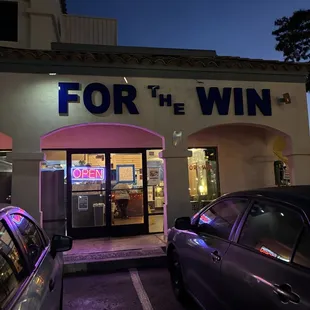 a car parked in front of a restaurant