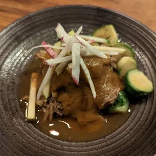 Braised pork and chipotle adobo with brussel sprouts, Rhode Island greening apples, and winter daikon