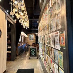 a long hallway with posters on the wall