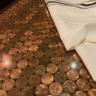 The tabletops are covered in Pennie's. Such a honey, cozy atmosphere!