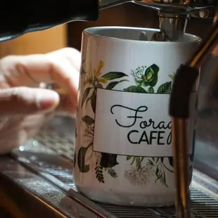 coffee being poured into a mug