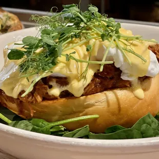 Eggs Bennie: Smoked bbq pork, toasted challah bread, spinach, soft poached eggs, hollandaise, microgreens