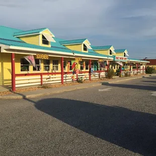 a row of yellow and blue buildings