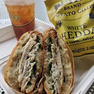 Citrus chicken panini With chicken breast, spiced cilantro spread, baby arugula, sliced sweet onions, provolone on slipper bun