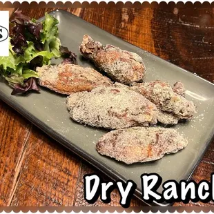 a plate of fried chicken with lettuce