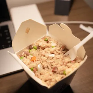 roast pork fried rice, stuffed to the brim and in a deep takeout box