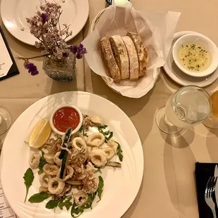 Beautiful spread with calamari bread, dipping oil, and drinks