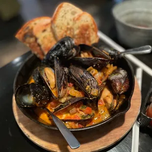 Mussels, soak up that bread, yummy sauce!