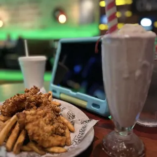 Kids chicken tenders , fries and strawberry milkshake