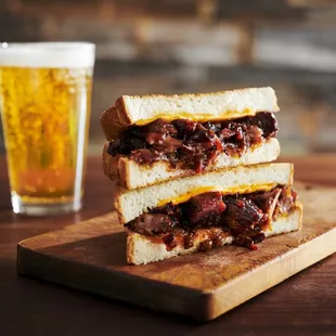 a sandwich and a glass of beer