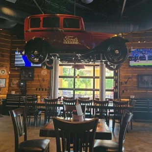 a car suspended from the ceiling