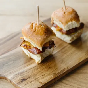 two mini sandwiches on a cutting board