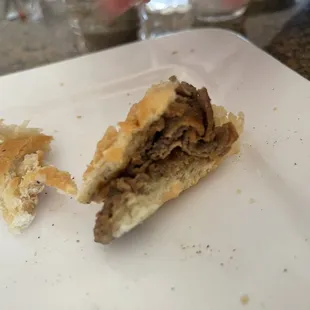 This is what is left of the steak sandwich I had that supposedly had &quot;extra&quot; cheese on it. Bland.