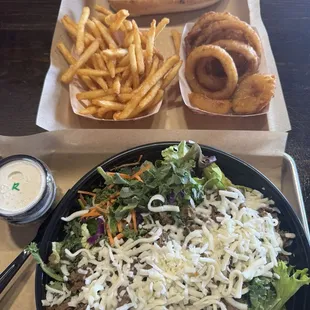 Large Steak salad, regular cheesesteak, fries and onion rings