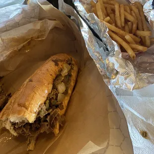 1/2 of large cheesesteak and Cheese Fries