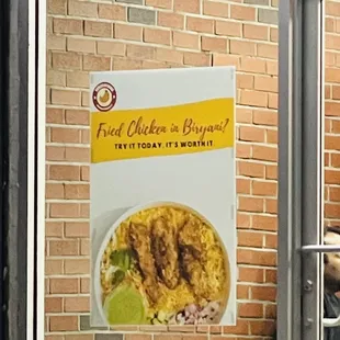 a poster on a brick wall