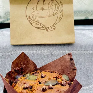 a muffin in a paper bag